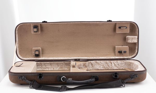 A violin case, branded Gewa