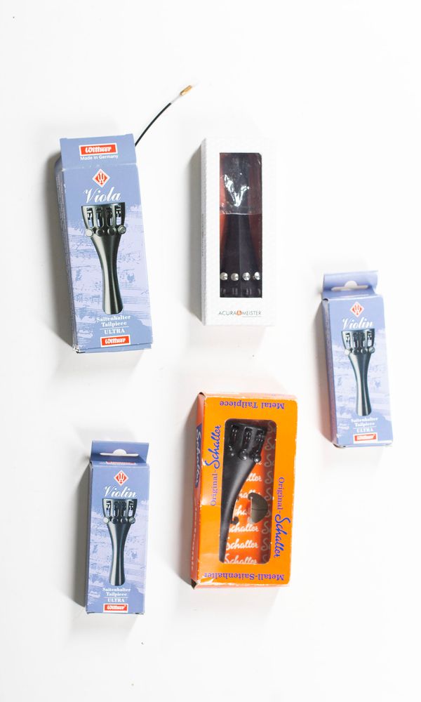 A bundle of forty-four violin tailpieces