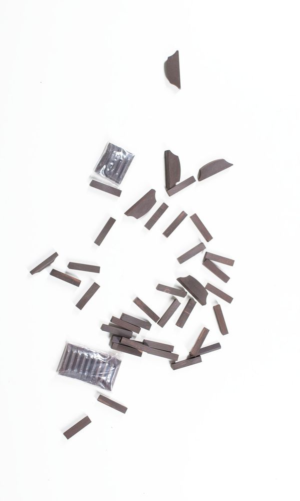 A bundle of violin/viola saddles and cello nuts