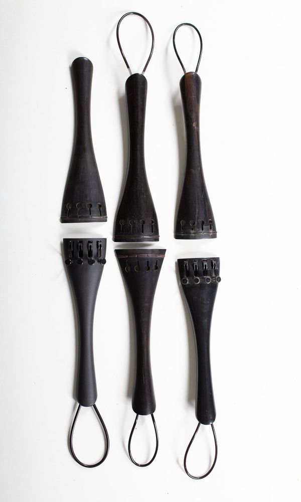 Six cello tailpieces