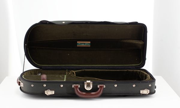 A violin case, branded Maurizio Riboni