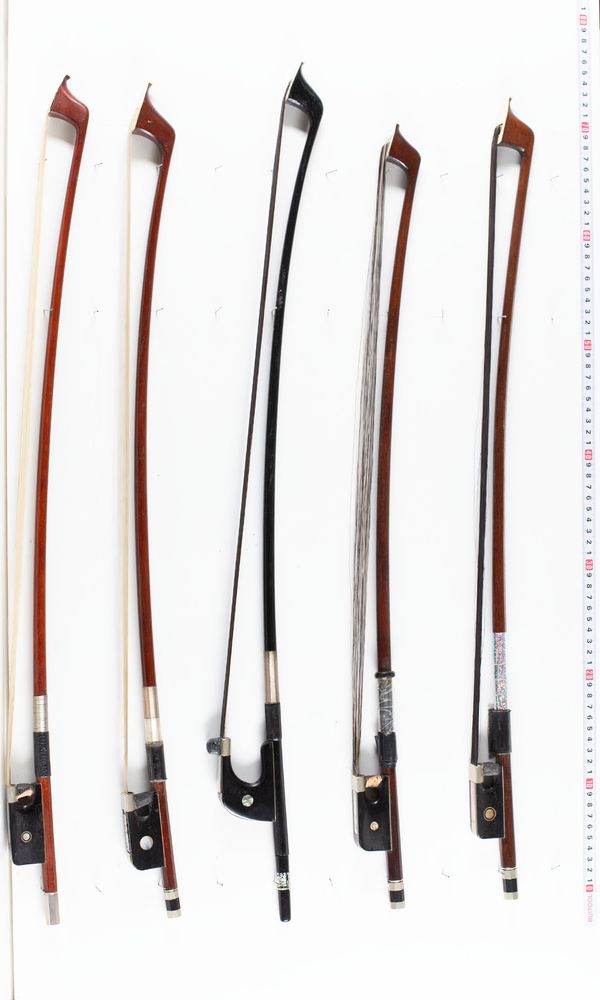 A bundle of five double bass bows, varying sizes