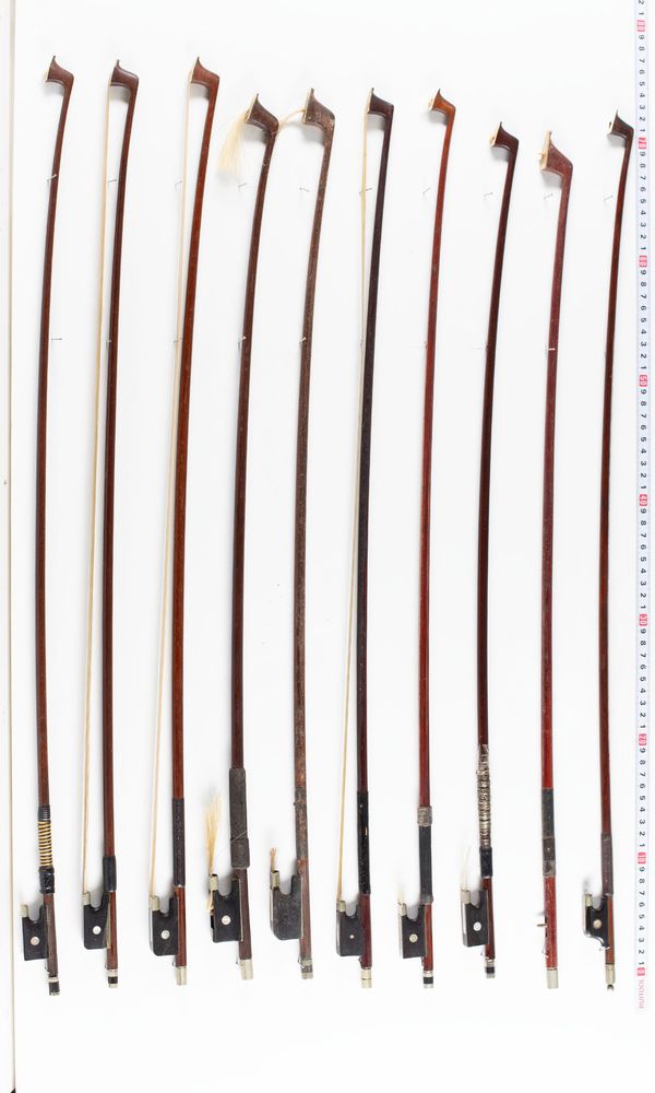 A bundle of twelve bows and one bow stick, varying sizes
