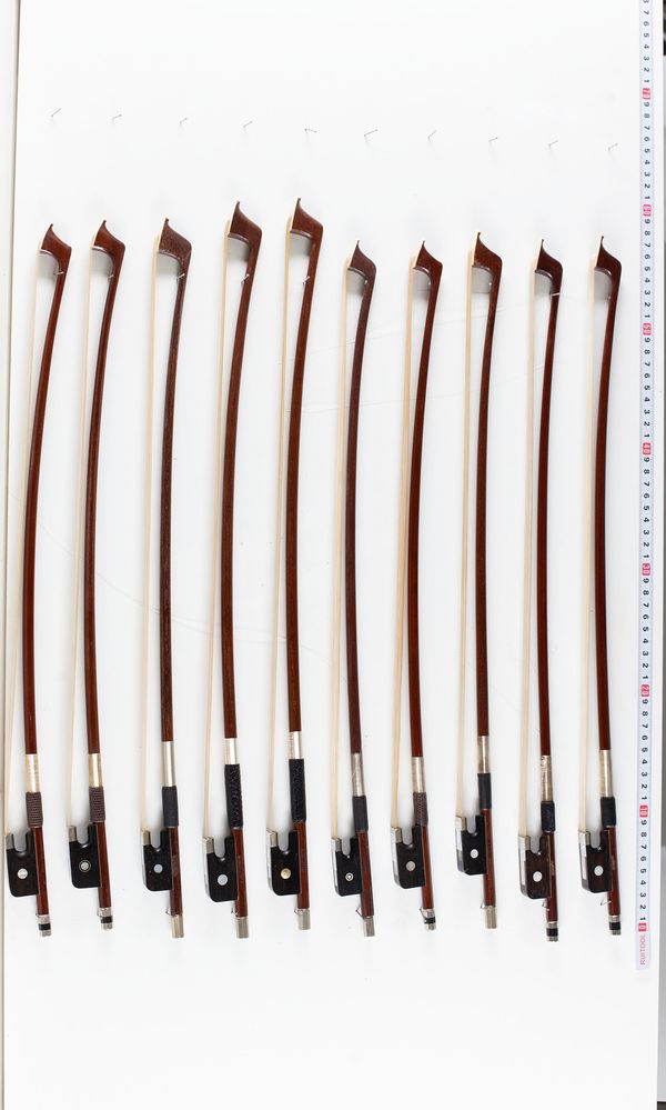 A bundle of ten 1/4 Sized cello bows, varying sizes