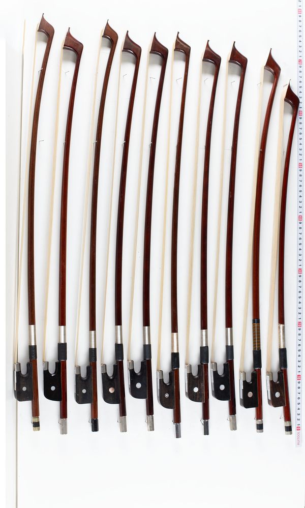 A bundle of ten double bass bows, varying sizes