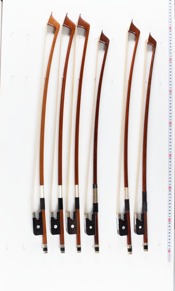 A bundle of six double bass bows, varying sizes
