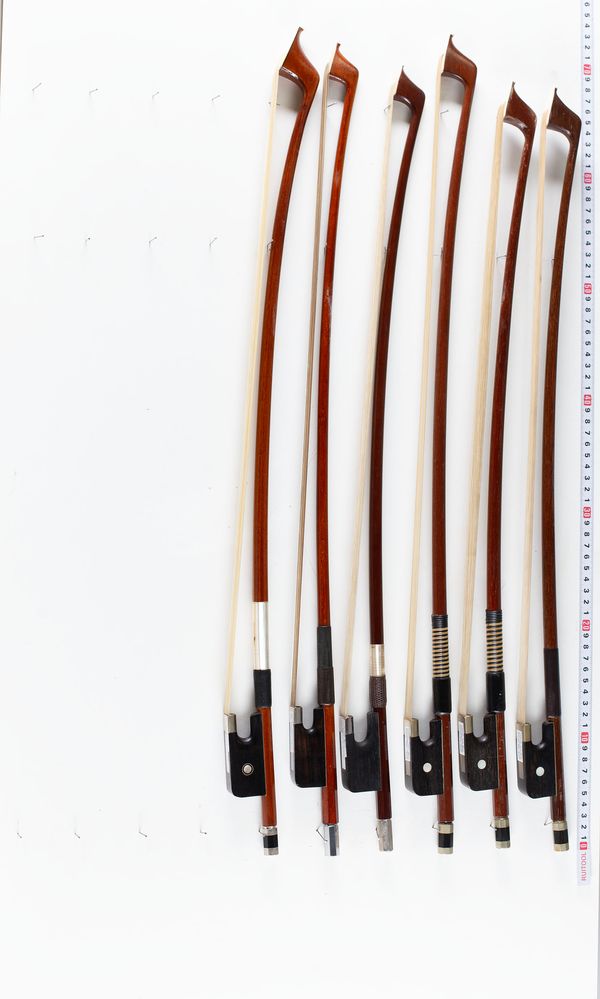 A bundle of six double bass bows, varying sizes