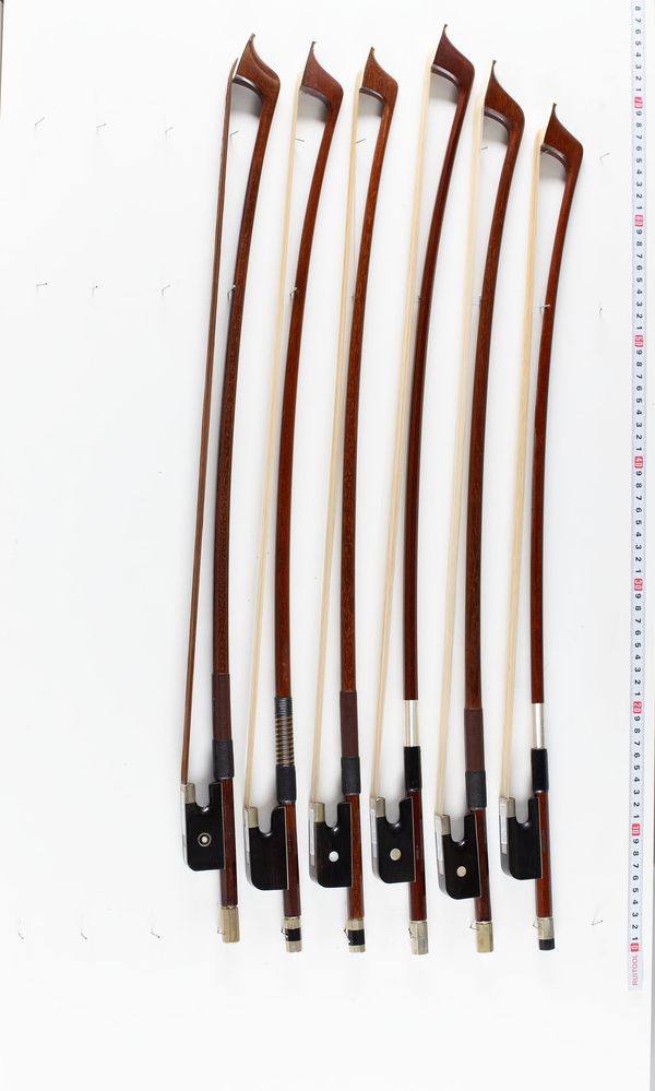 A bundle of six double bass bows, varying sizes