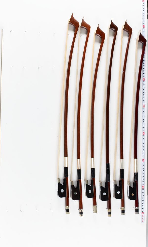 A bundle of six double bass bows, varying sizes