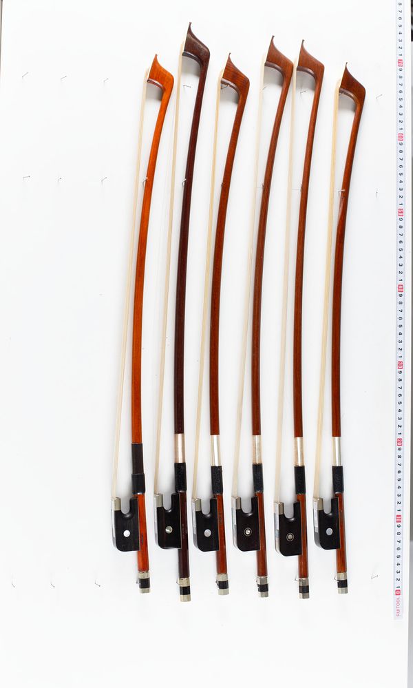 A bundle of six double bass bows, varying sizes