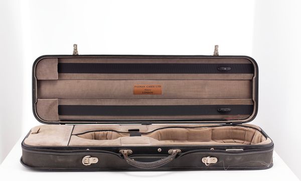 A violin case, branded Paxman