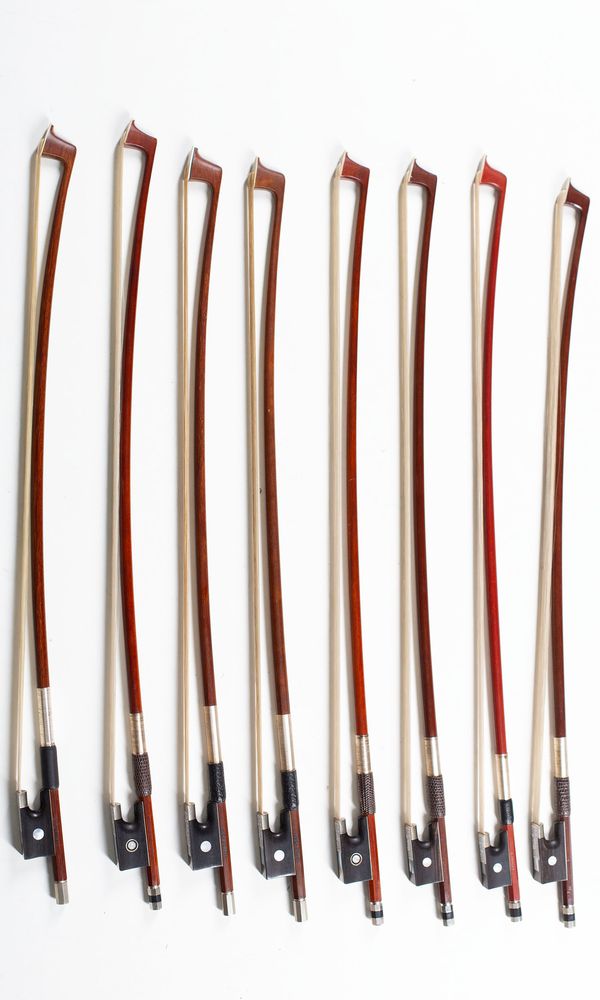 A bundle of eight 1/8 sized violin bows, varying sizes
