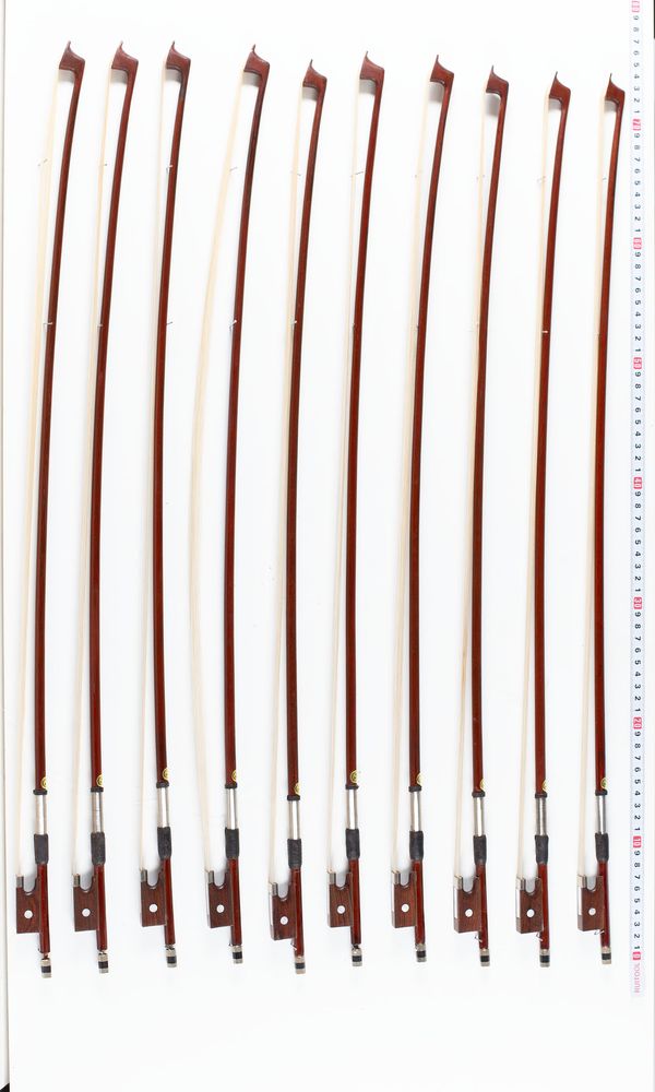 A bundle of ten violin bows, varying sizes