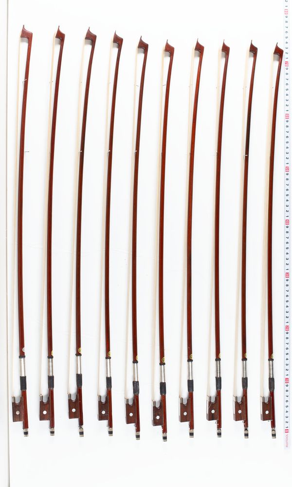 A bundle of ten violin bows, varying sizes