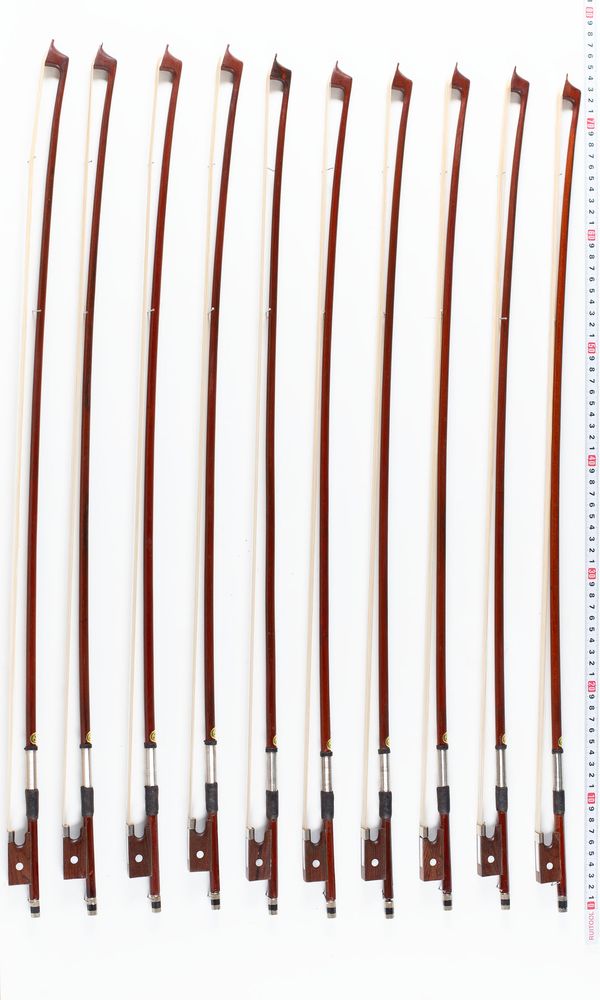 A bundle of ten violin bows