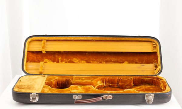 A violin case, branded Jaeger