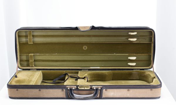 A violin case, branded M. A. Gordge