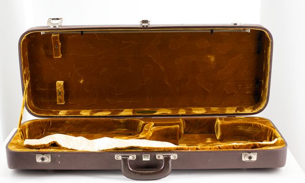 A double violin case, branded Gewa