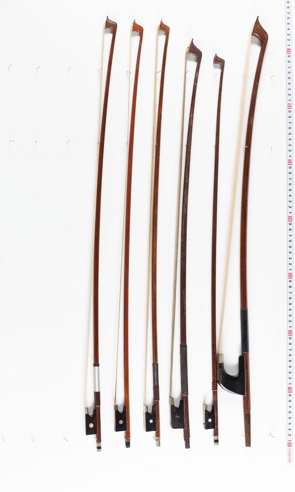 A bundle of fifteen bows, varying lengths and sizes