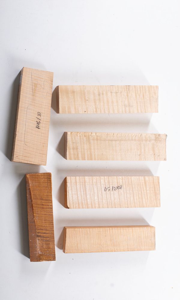 Ten maple neck blocks