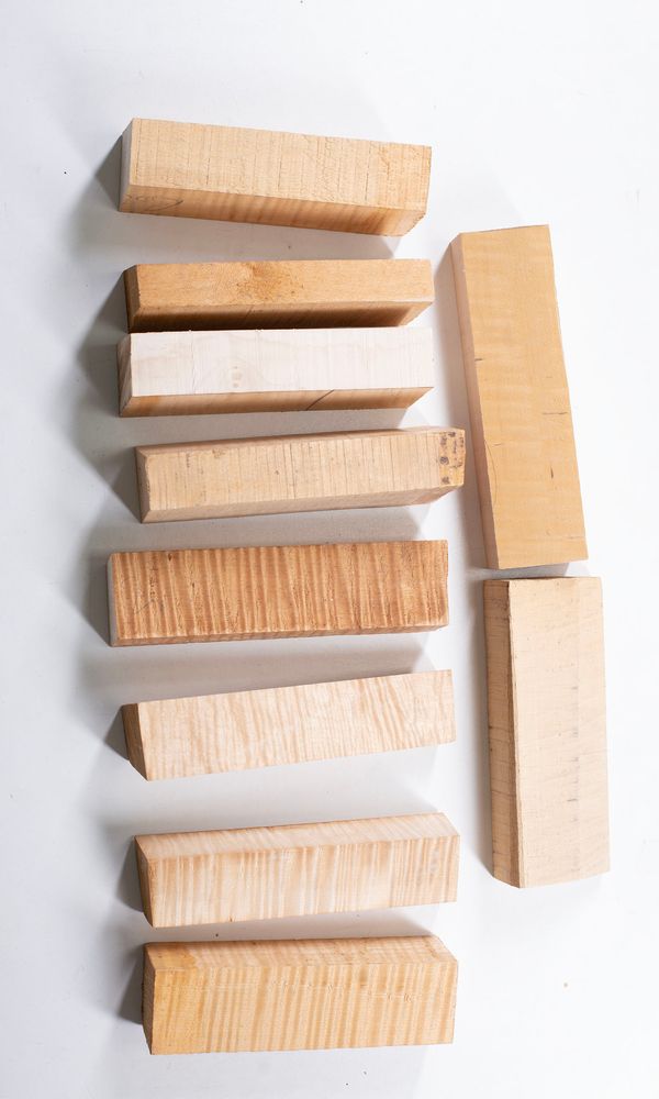 Ten maple neck blocks