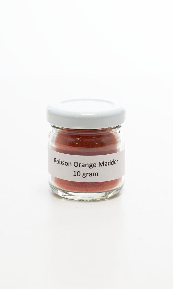 A jar of orange madder
