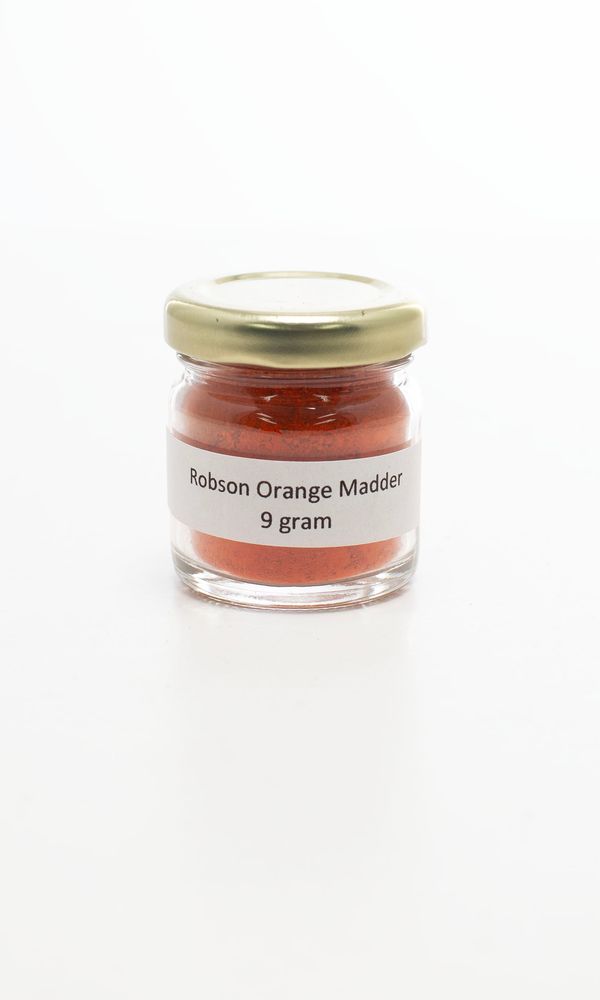 A jar of orange madder