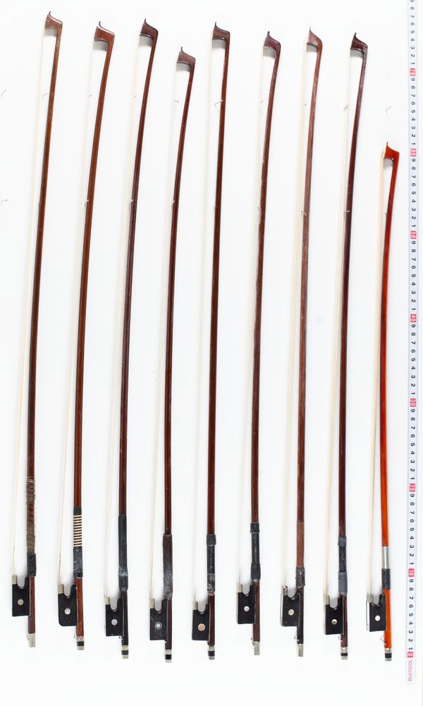 Nine violin bows, varying lengths