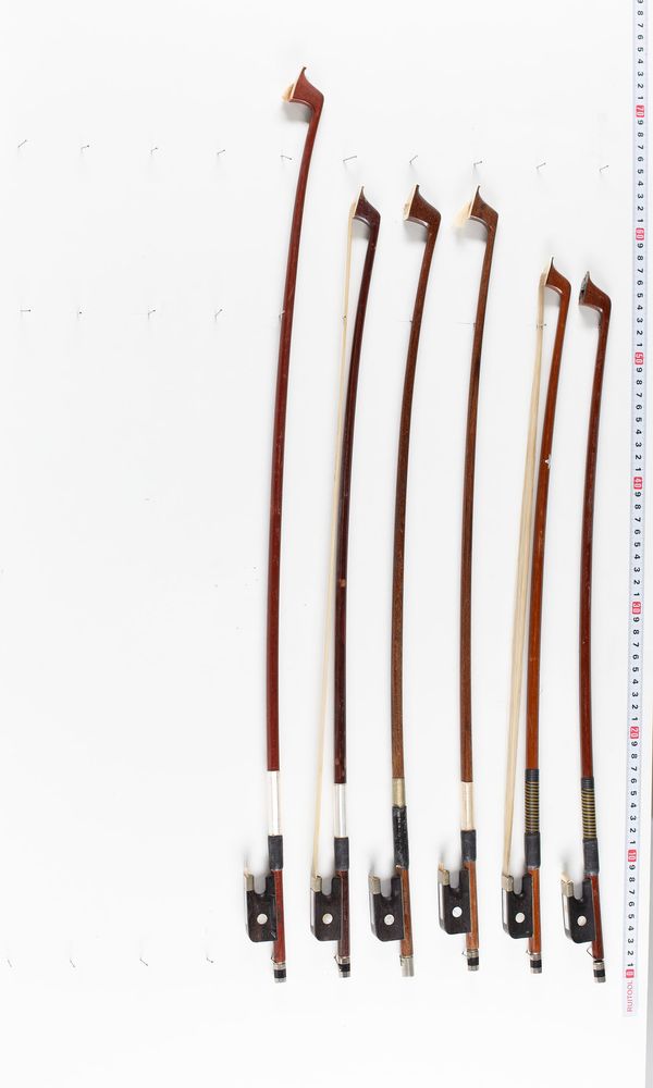 A bundle of six cello bows, varying sizes