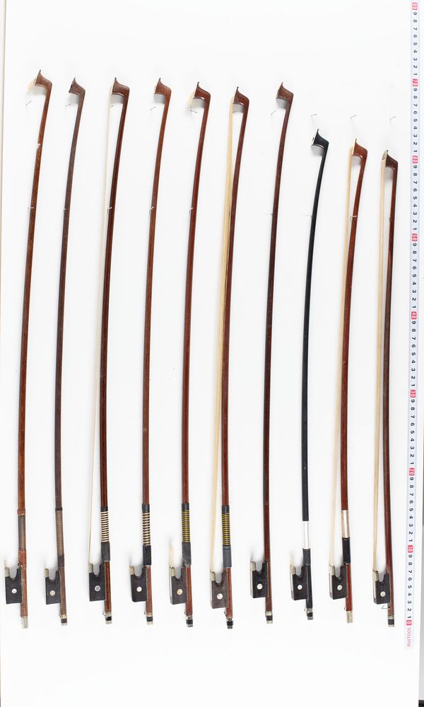 A bundle of eleven fractional violin bows, varying sizes