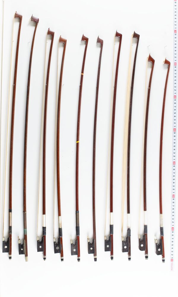 A bundle of eighteen violin bows and one bow stick, varying lengths