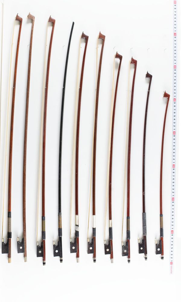 A bundle of twenty-one violin bows, varying lengths