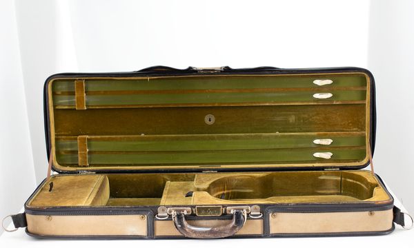 A violin case branded M. A. Gordge
