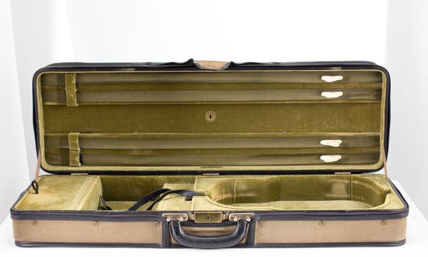 A violin case branded M. A. Gordge
