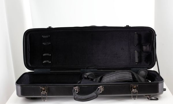 A violin case, branded JW Omebaige