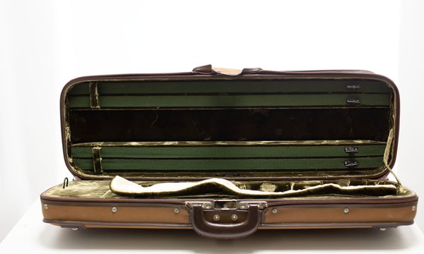 A violin case, labelled Jaeger Etui