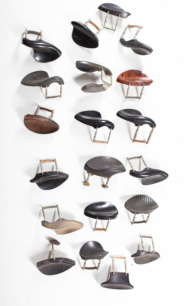 A bundle of forty chin rests, varying sizes