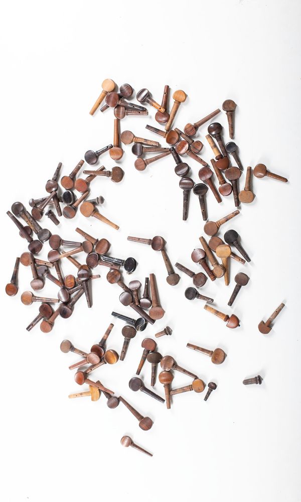 A bundle of ninety-seven violin pegs, varying sizes