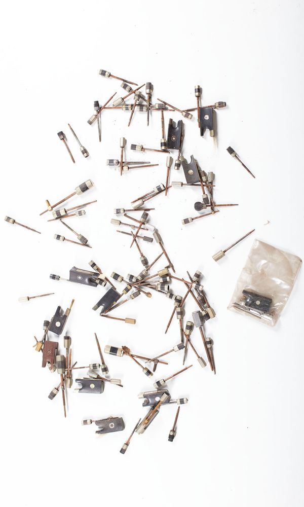 A bundle of fourteen violin / viola frogs (with adjusters), and seventy-seven adjusters, varying sizes