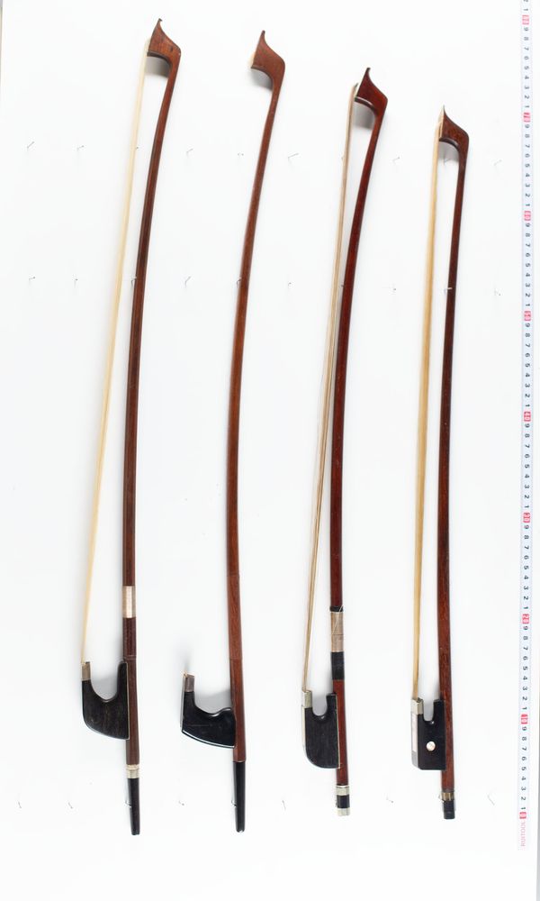 A bundle of nine double-bass bows, varying lengths