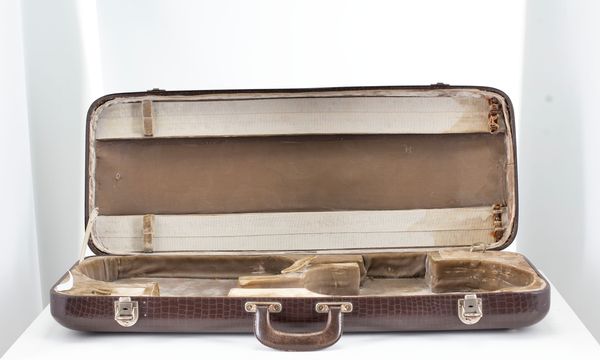 A double violin case, branded Jaeger