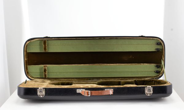 A violin case, branded Jaeger