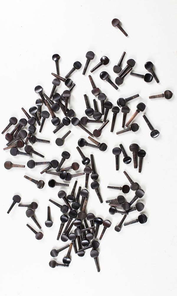 A bundle of one-hundred violin pegs, varying sizes