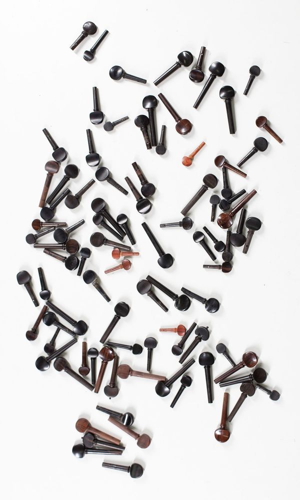 A bundle of ninety violin pegs, varying sizes