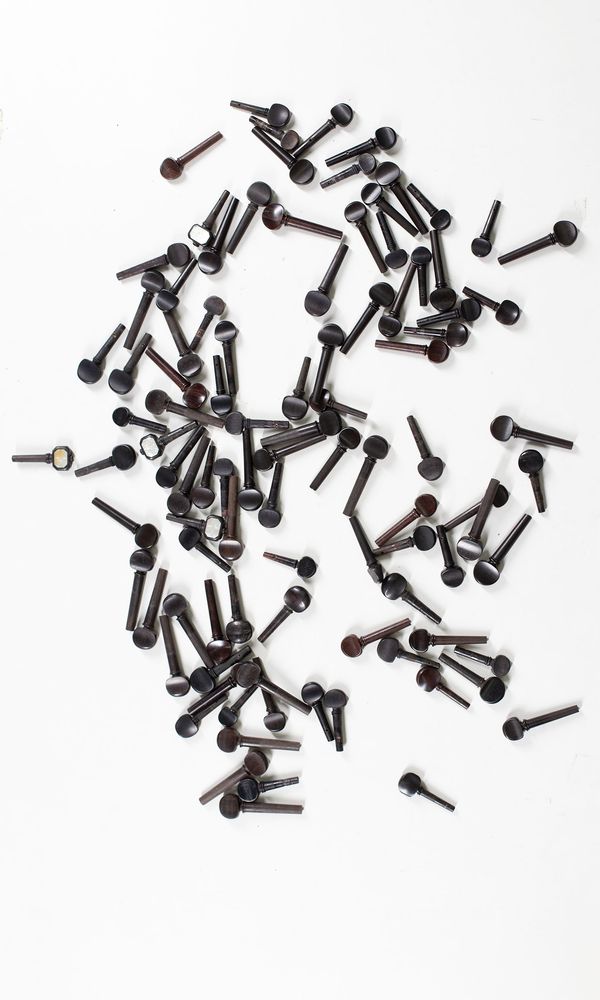 A bundle of one-hundred violin pegs, varying sizes