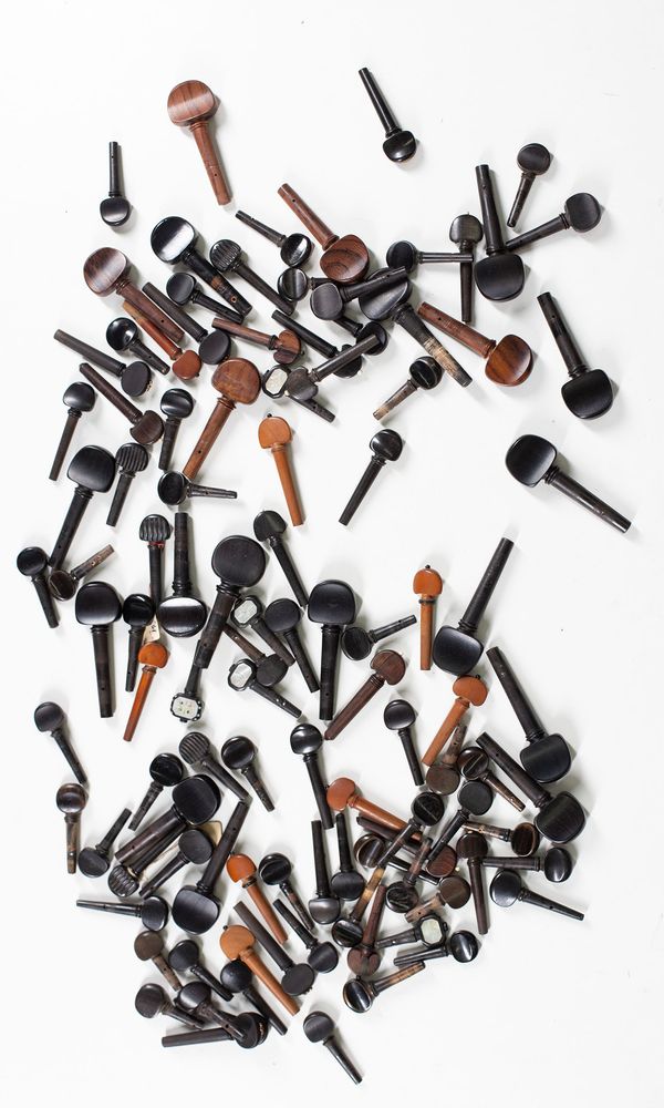 A bundle of one-hundred and seven mixed cello and violin pegs, varying sizes