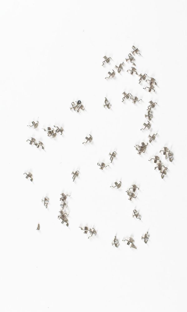 A bundle of fifty fine tuner parts