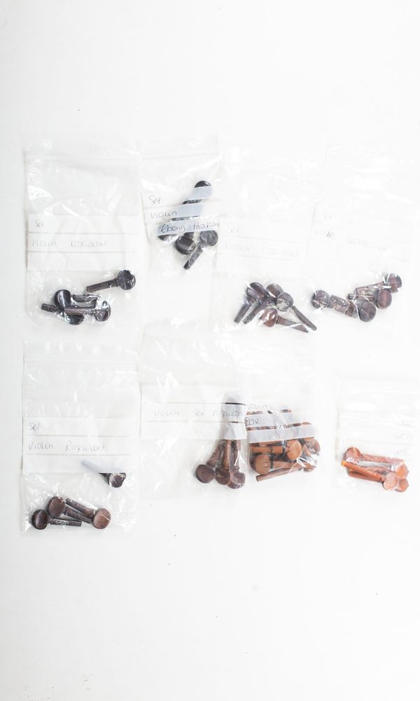 Forty-two sets of violin pegs