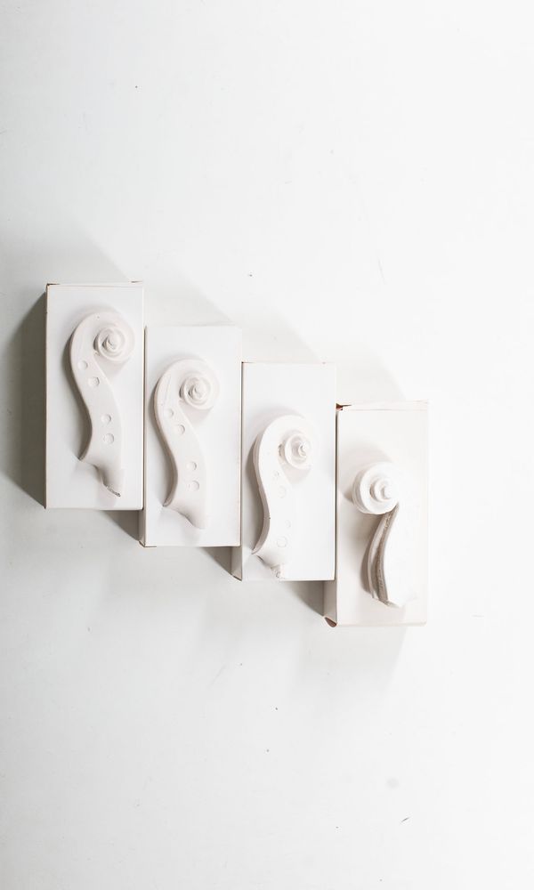 Two Guadagnini, one Rogeri and one Grancino scroll cast