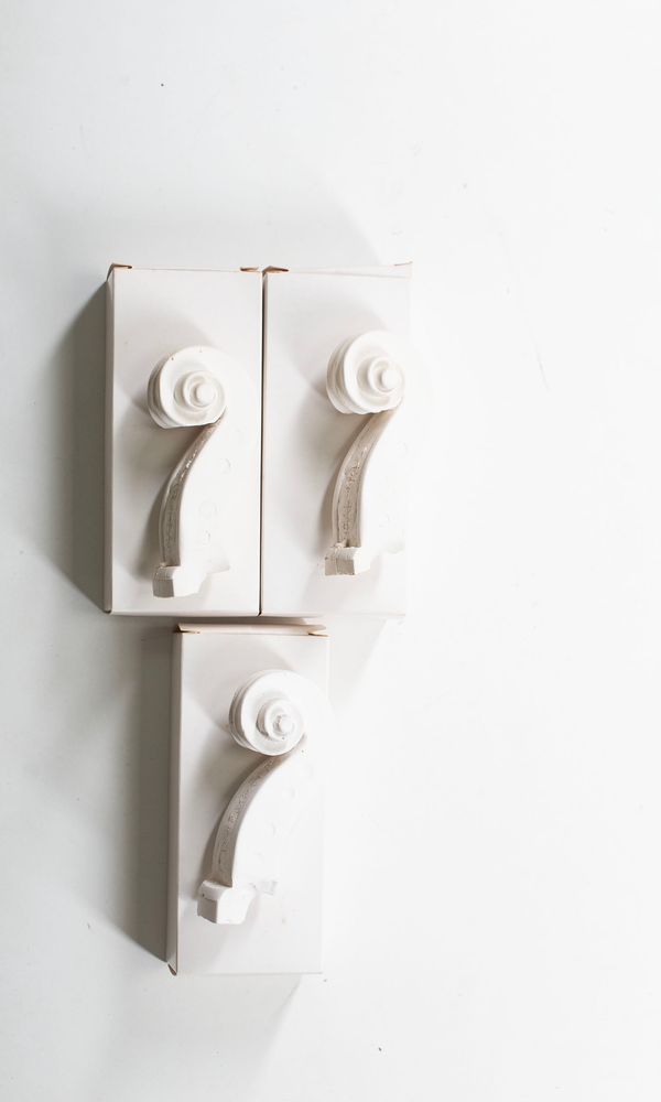Three Guarneri family scroll casts